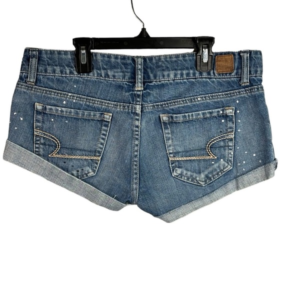 American Eagle Rolled Cuff Denim Cut Off Shorts Size 8 Tiny Paint Drops Raw Hem - Picture 2 of 9